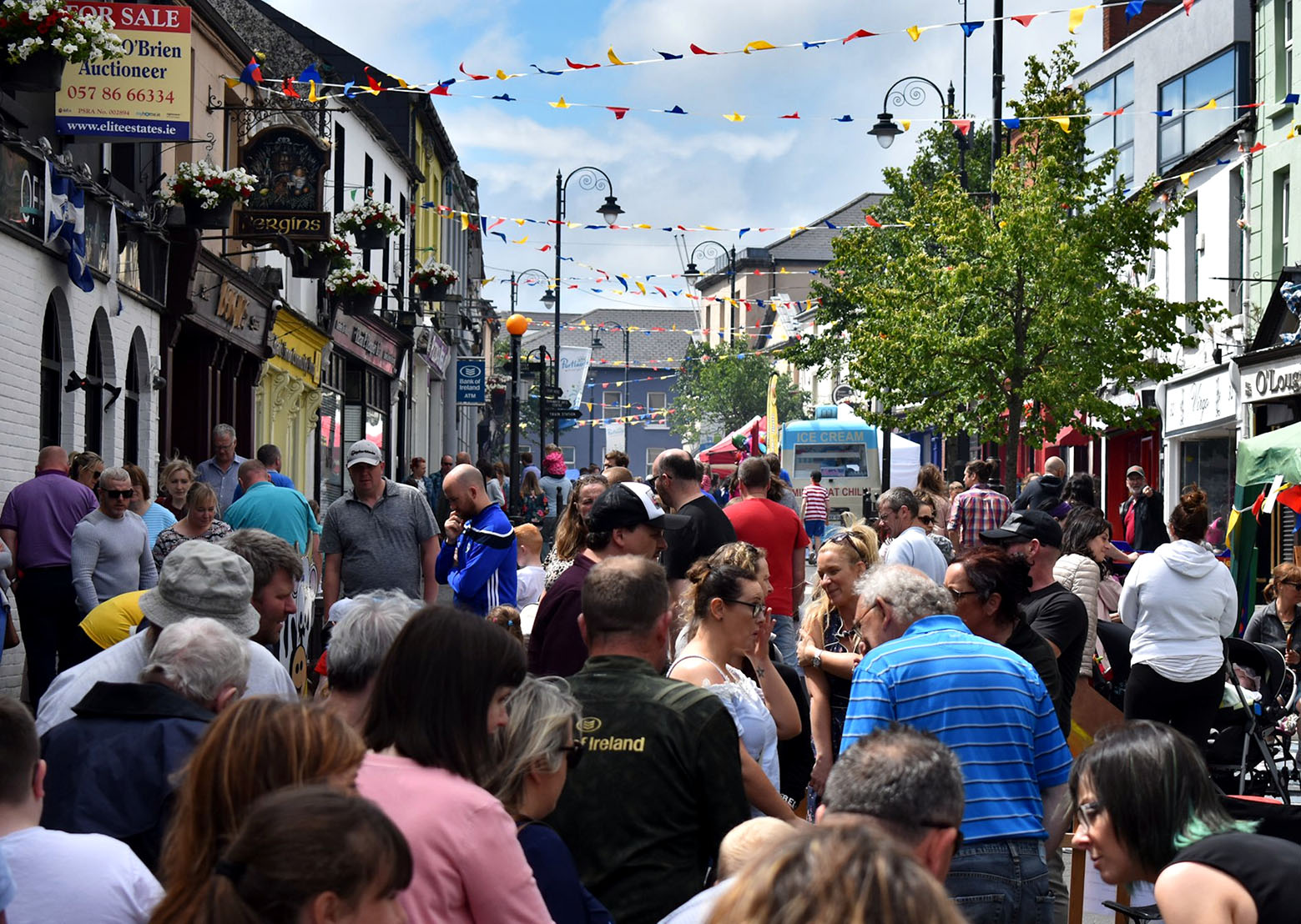 Many people interacting on crowdy main street during Old Fort Quarter Festival june 2019, Portlaoise, Ireland